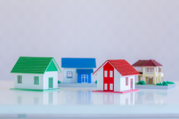 Model of house painted white under the tiled roof