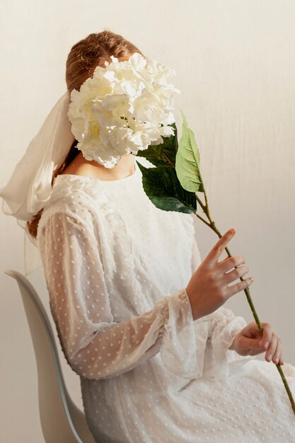 Model posing with flower