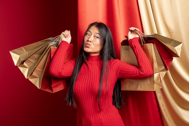 Model posing with paper bags for chinese new year