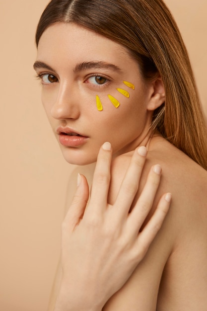 Model posing with petals close up