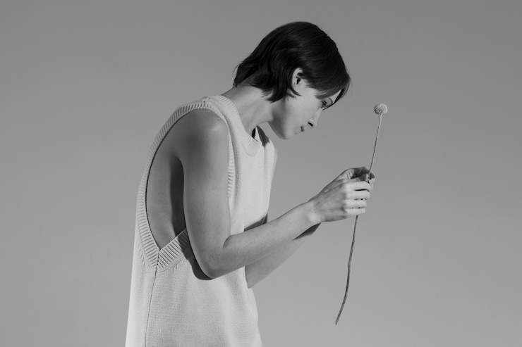 Free Photo model posing with plant medium shot