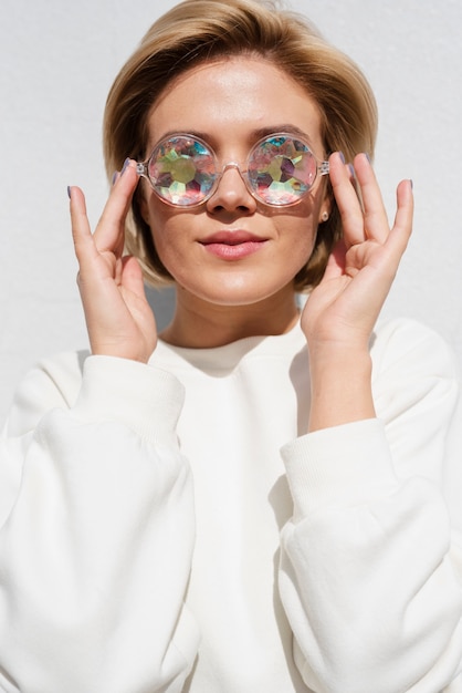 Free photo model wearing holographic glasses