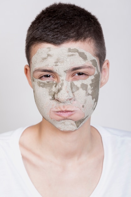 Model with face mask looking at camera