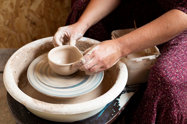 Modeling in clay on a potter's wheel high view