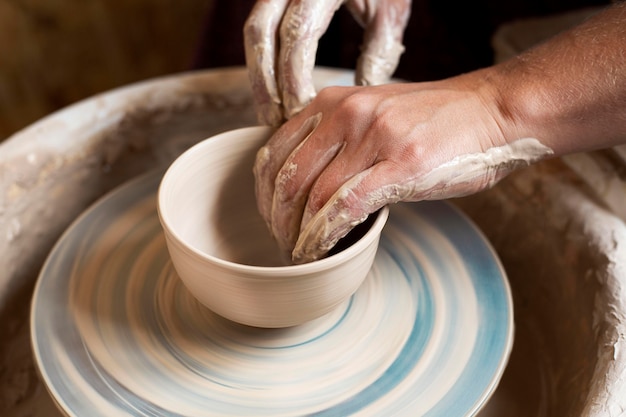 Modeling in clay on a potter's wheel