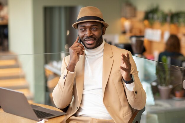 Modern african american man working in a caffe