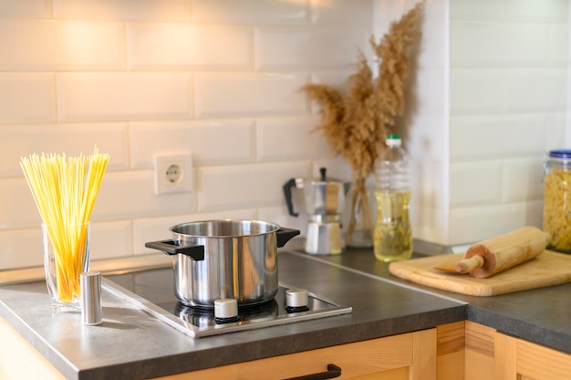 Free photo modern apartment kitchen with pasta in glass
