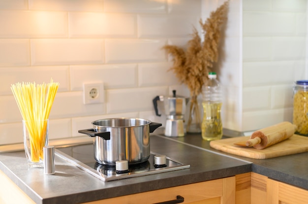 Modern apartment kitchen with pasta in glass