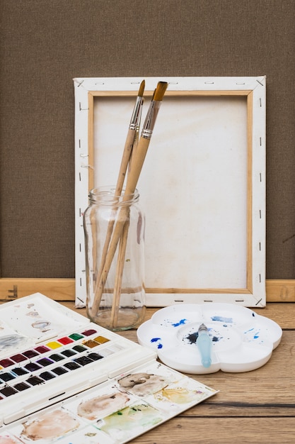 Modern artist concept with brushes and colorful paint