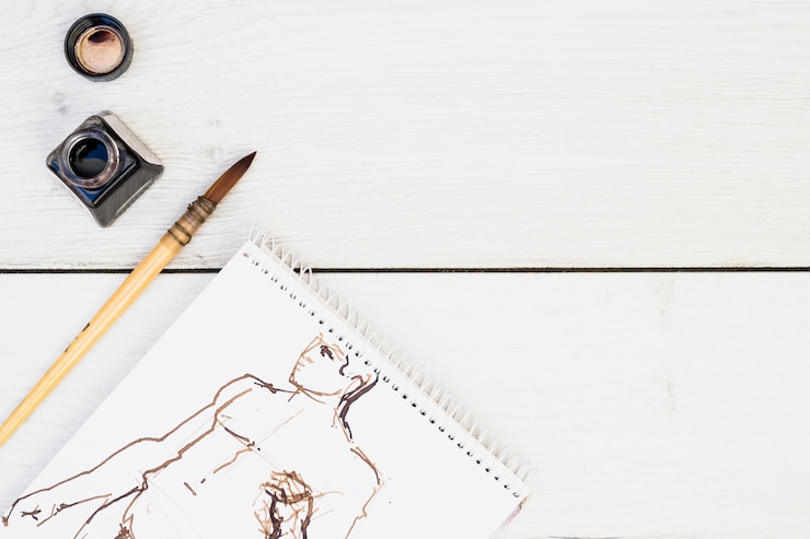 Free Photo modern artist concept with notebook and brush