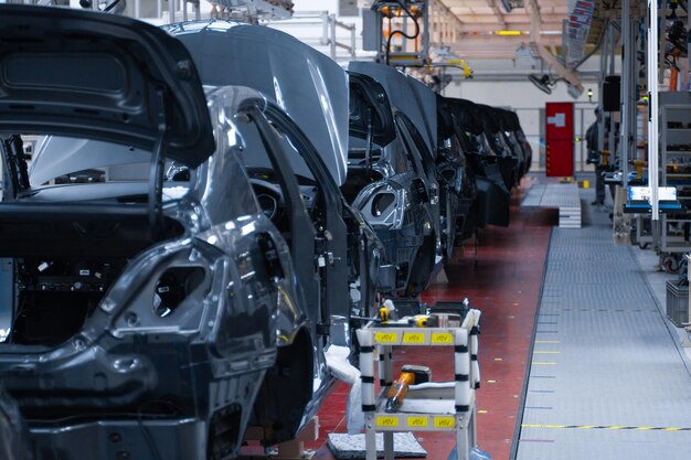 Modern automobile production line automated production equipment Shop for the Assembly of new modern cars The way of Assembly of the car on the Assembly line at the plant