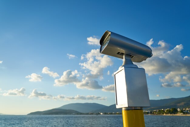 Modern binoculars with city background