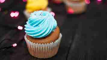 Free photo modern birthday composition with lovely cupcake