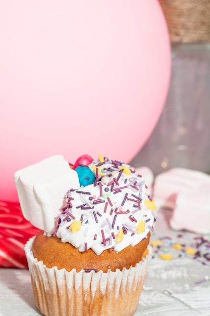 Free photo modern birthday composition with lovely cupcake