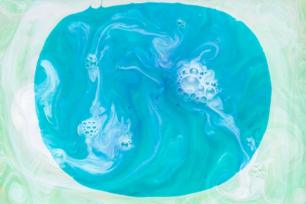 Modern blue fluid on green artwork backdrop