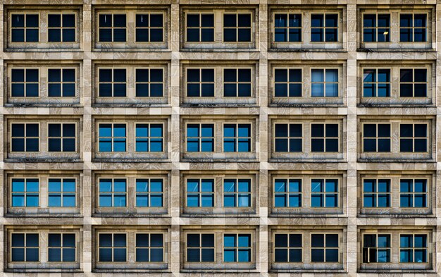 Modern building with glass windows silently witnessing the life of the big city