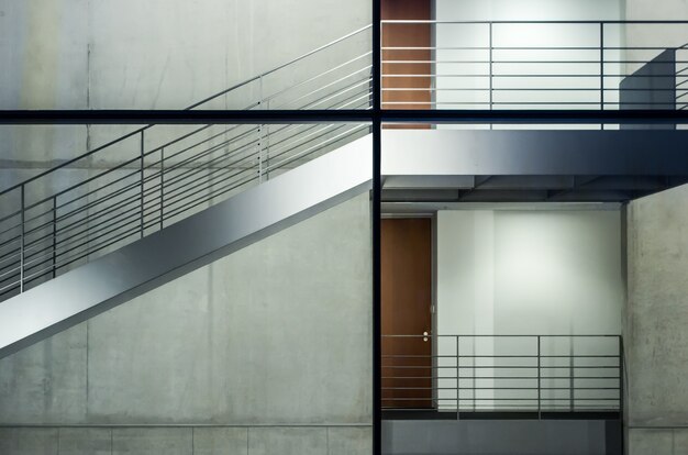 Modern building with glass windows and staircases under the lights