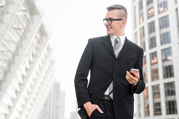 Modern businessman with smartphone