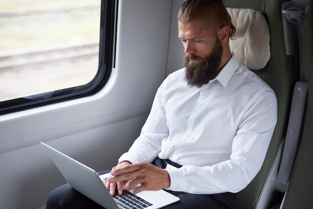 Modern businessman working in the train