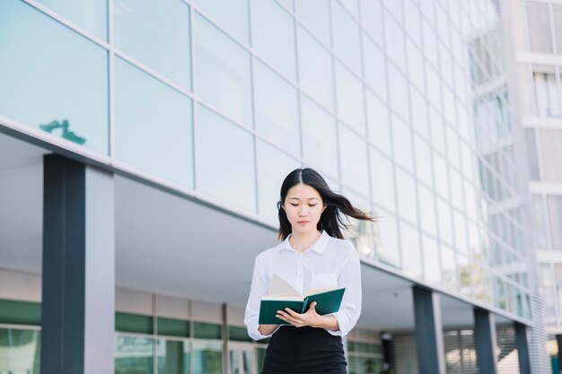 Modern businesswoman reading