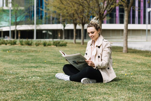 Modern businesswoman relaxing in park