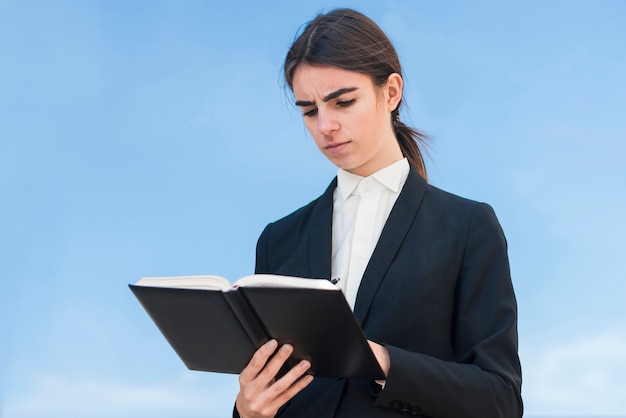 Modern businesswoman with book