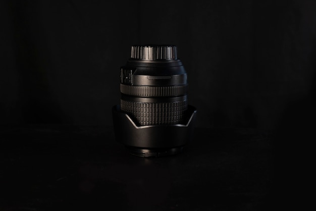 Modern camera lens on black background. close-up. space for text. and photography concept