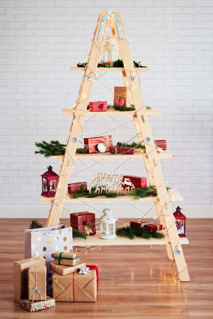 Modern christmas tree with toys and presents