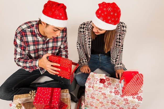 Modern couple gifting each other