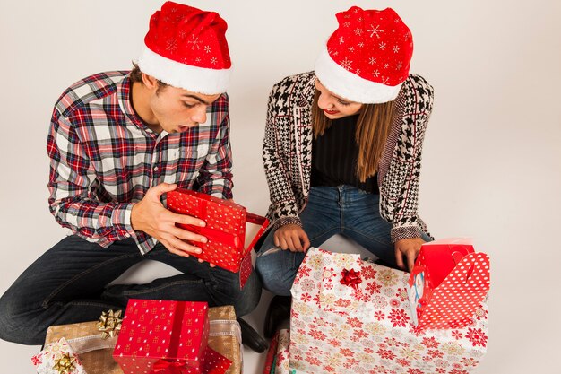 Modern couple gifting each other