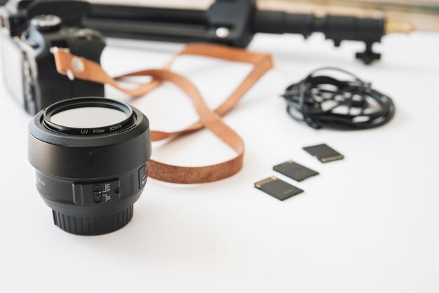 Modern dslr camera; memory cards; camera lens; extension rings and memory card