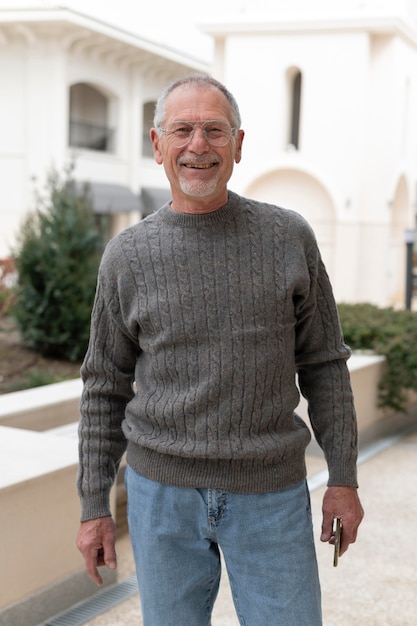 Modern elderly man outdoors