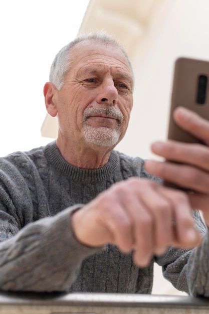 Modern elderly man outdoors