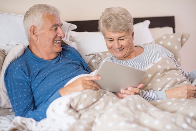 Modern grandparents resting in the bedroom