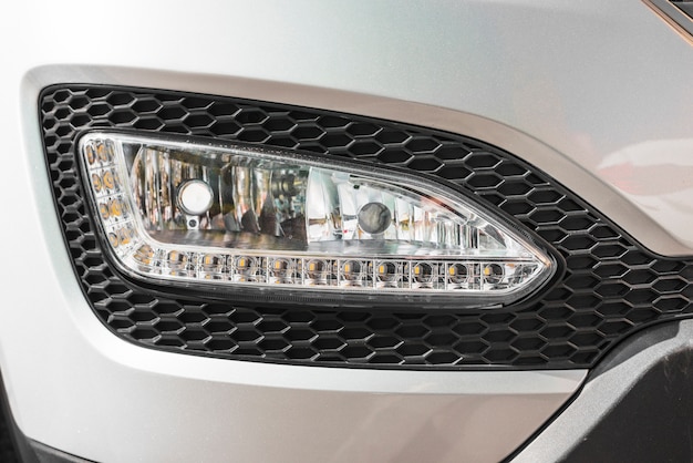 Modern headlight of silver auto