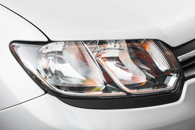 Free photo modern headlight of silver automobile