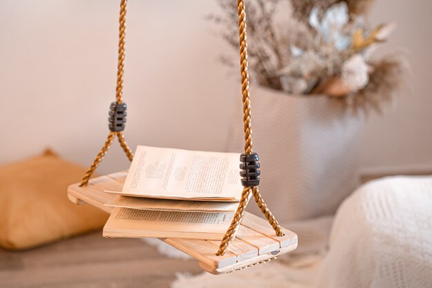 Modern interior of the living room with a hanging swing