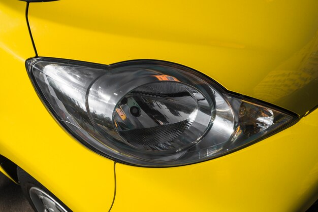 Modern led headlight of yellow car