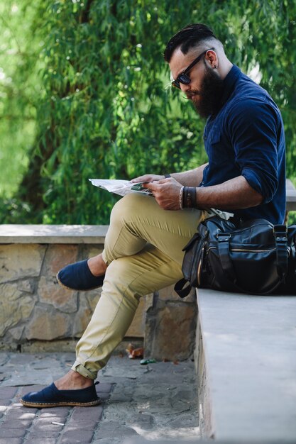 Modern man checking a map