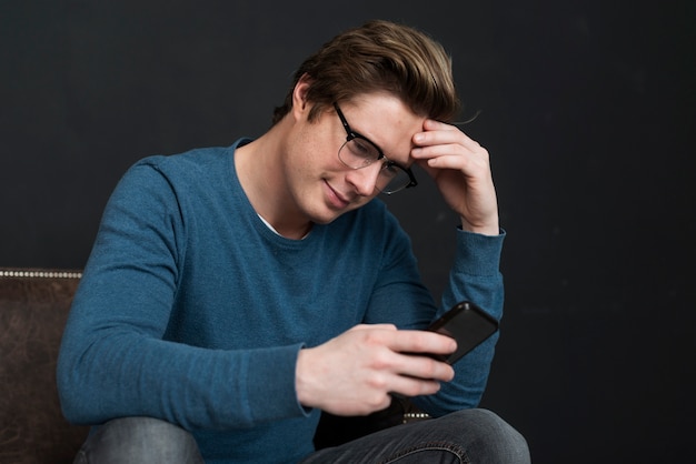 Modern man checking social media on his phone