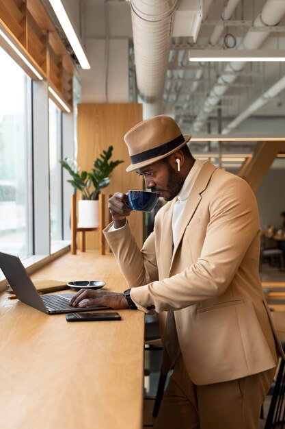 Modern man doing business in a caffe