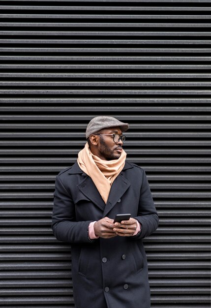 Modern man holding his smartphone