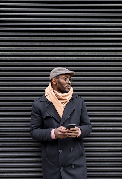 Modern man holding his smartphone