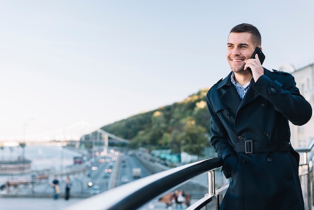 Modern man making phone call