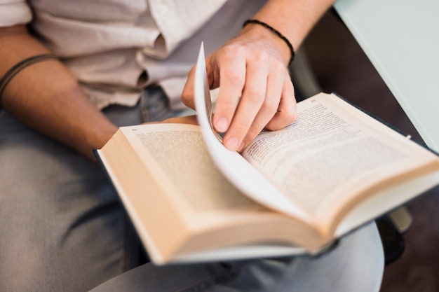 Modern man reading on couch