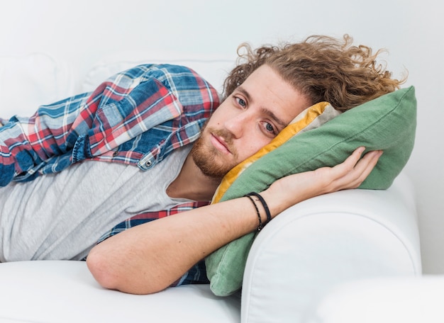 Free photo modern man relaxing on couch