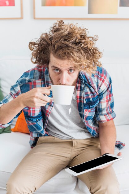 Modern man using table on couch