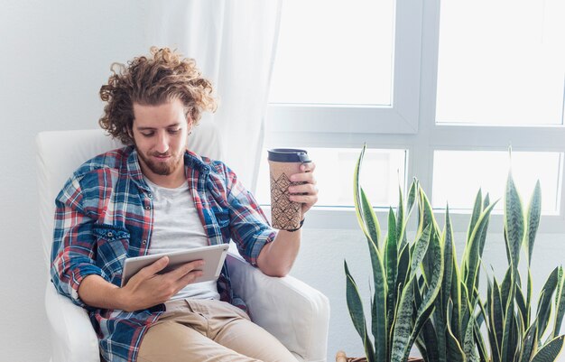 Modern man with table on couch