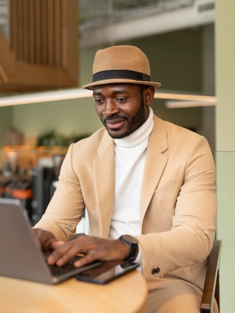 Modern man working in a caffe