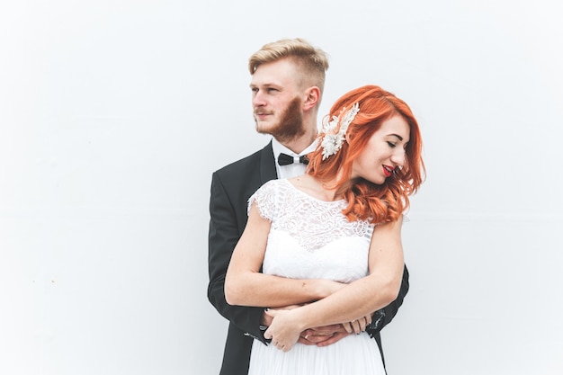 Modern newlyweds posing